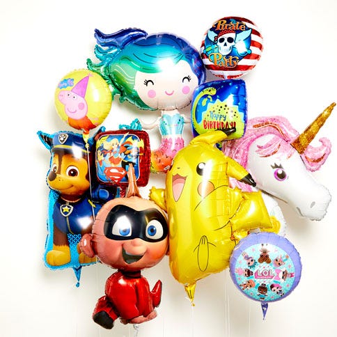 A selection of kids' balloons showing different characters including Pikachu, a unicorn and Paw Patrol